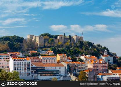 Lisbon. The Castle of St. George.. Exterior walls and towers with the flags of the castle of St. George. Lisbon. Portugal.