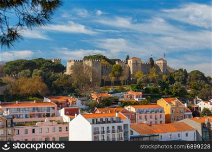 Lisbon. The Castle of St. George.. Exterior walls and towers with the flags of the castle of St. George. Lisbon. Portugal.