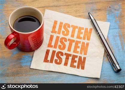 Listen - communication concept - word abstract on a napkin with a cup of coffee