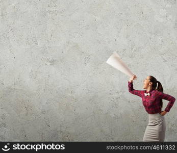 Listen everyone. Young woman making some announcement in trumpet