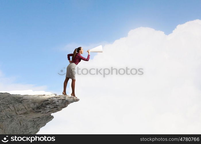 Listen everyone. Young woman making some announcement in trumpet