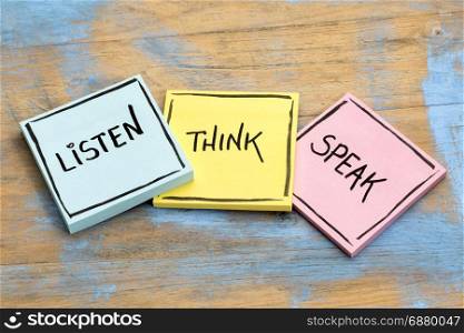 listen, think, speak - communication concept - handwriting in black ink on sticky notes against rustic wood