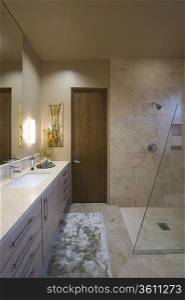 Lit bathroom with shower in Palm Springs home