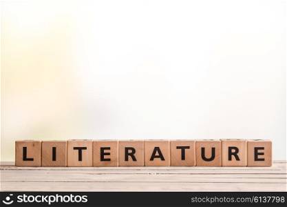 Literature sign made of wooden blocks on a school table