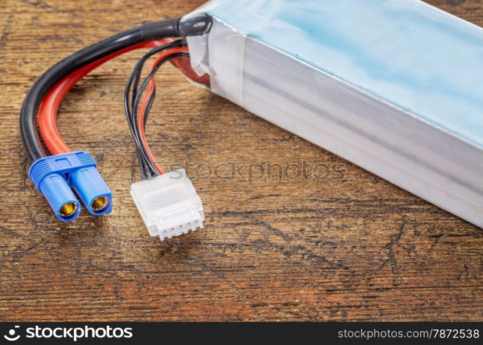 Lithium-ion polymer rechargeable battery (abbreviated as LiPo, LIP, Li-poly) with balancing and main power plugs. LiPo batteries are used in portable electronics, drones and radio controlled models.