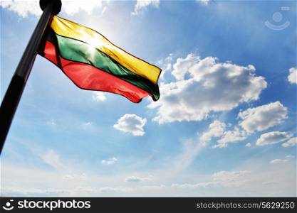 Lithuanian flag flies on ship and background of blue sky