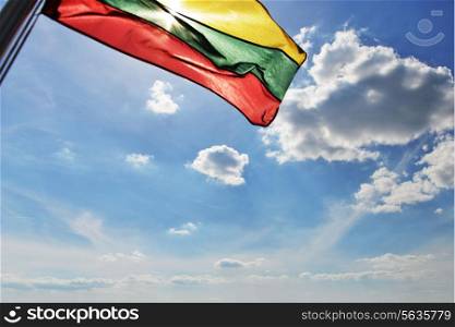 Lithuanian flag flies on ship and background of blue sky