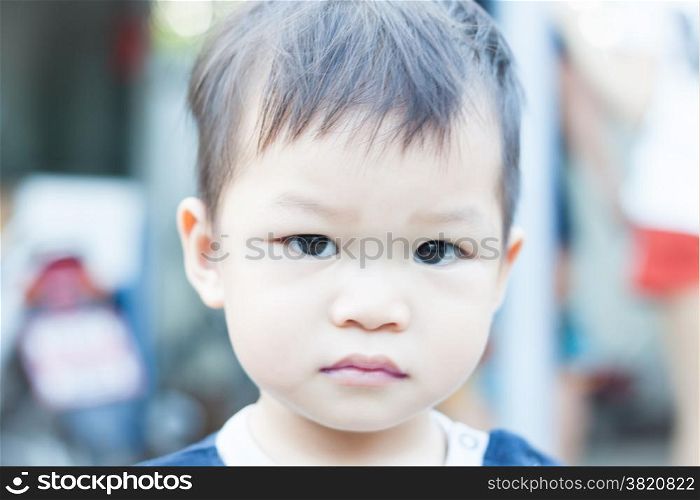Little asian boy looking at camera , stock photo