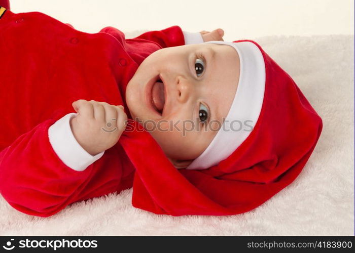 little baby dressed as santa claus. infant as santa claus