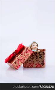 Little baby figure in a gift box