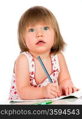 Little baby girl draws pencil on a white background