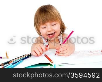 Little baby girl draws pencil on a white background