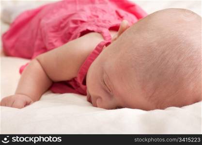 Little baby girl lying on stomach