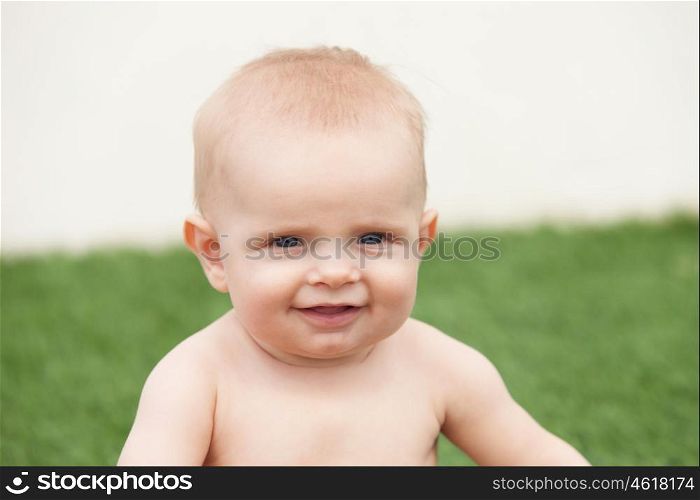 Little baby six month with blue eyes and blond hair gesturing
