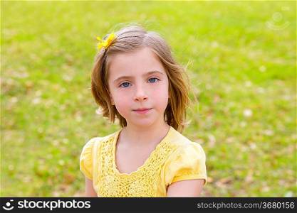 little blond girl portrait in park outdoor