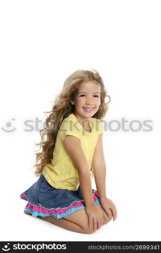 little blond girl smiling portrait on her knees isolated on white background