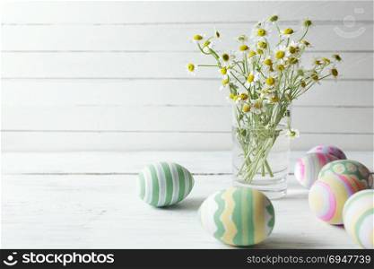 Little blonde girl showing eggs before coloring for Easter holiday at home. Little blonde girl showing eggs before coloring for Easter holiday at home.