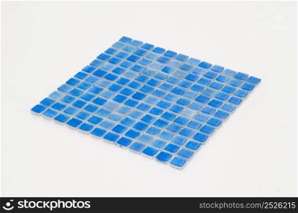 little blue ceramic tile on a white background, majolica. for the catalog. square small tile