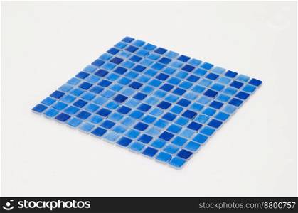 little blue ceramic tile on a white background, majolica. for the catalog. square small tile