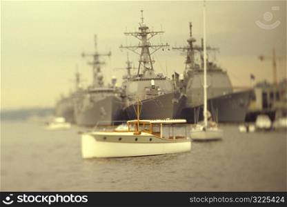 Little Boat in front of Battleships