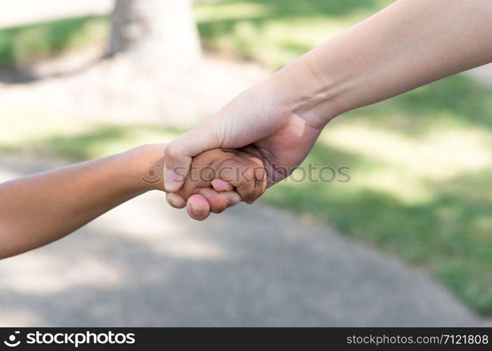 little boy and girl holding hands