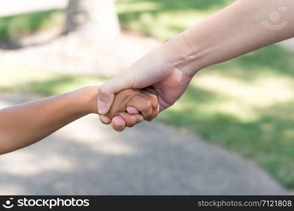 little boy and girl holding hands