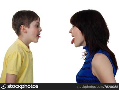 little boy and young woman put out each other tongues on the white background