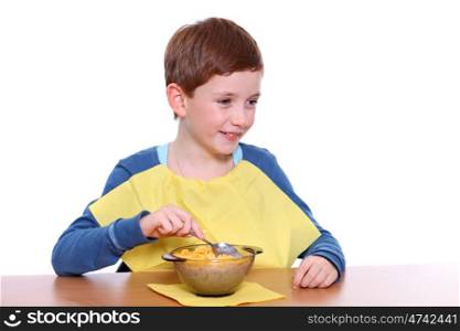 Little boy breakfast isolated over white background