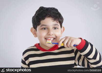 Little boy brushing his teeth