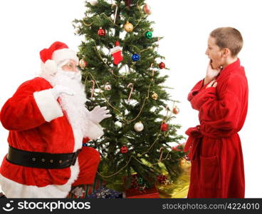 Little boy catches Santa in the act of bringing Christmas presents. White background