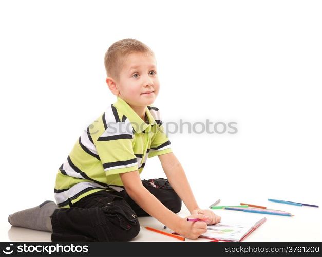 little boy drawing with color pencils on floor isolated on white background