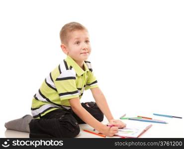 little boy drawing with color pencils on floor isolated on white background