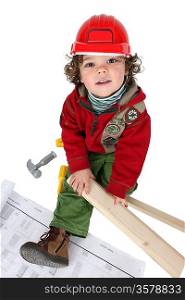 Little boy dressed as a builder
