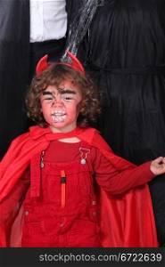 little boy dressed as a devil