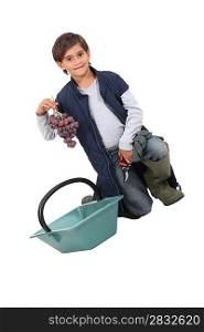 little boy dressed as grape-picker