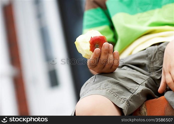 Little Boy Eating an Apple