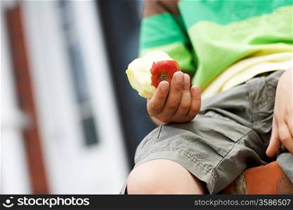 Little Boy Eating an Apple