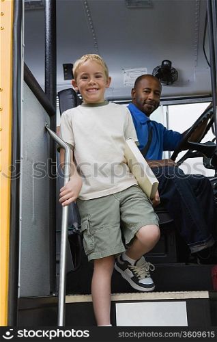 Little Boy Getting off of Schoolbus
