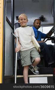Little Boy Getting off of Schoolbus