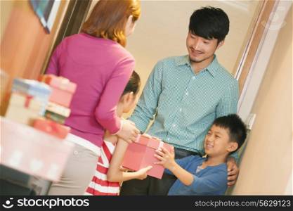 Little Boy Giving Little Girl a Gift