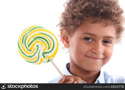 Little boy holding lollipop