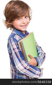 Little boy holding school books over white