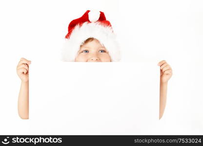 Little boy in a Christmas suit shows the blank form, isolated