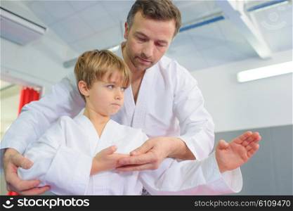 Little boy in a karate lesson