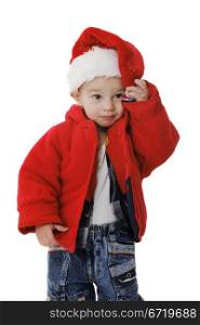 Little boy in a Santa Claus hat on the white background