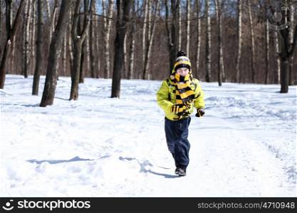 Little boy in a winter park