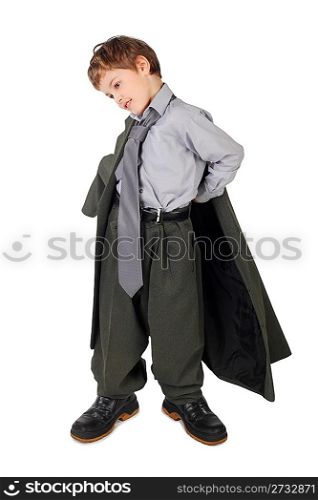 little boy in big grey man&acute;s suit and boots dressing jacket isolated on white background