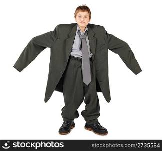 little boy in big grey man&acute;s suit and boots nads at sides isolated on white background
