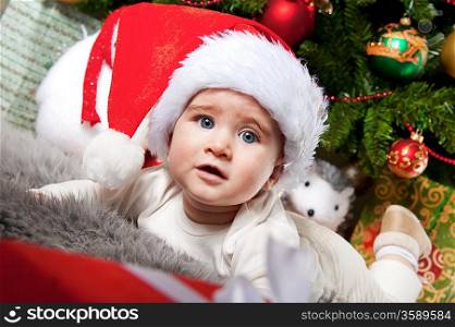 Little boy in Santa Claus hat.