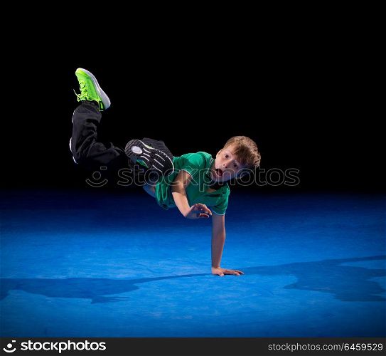 Little boy in sports hall isolated